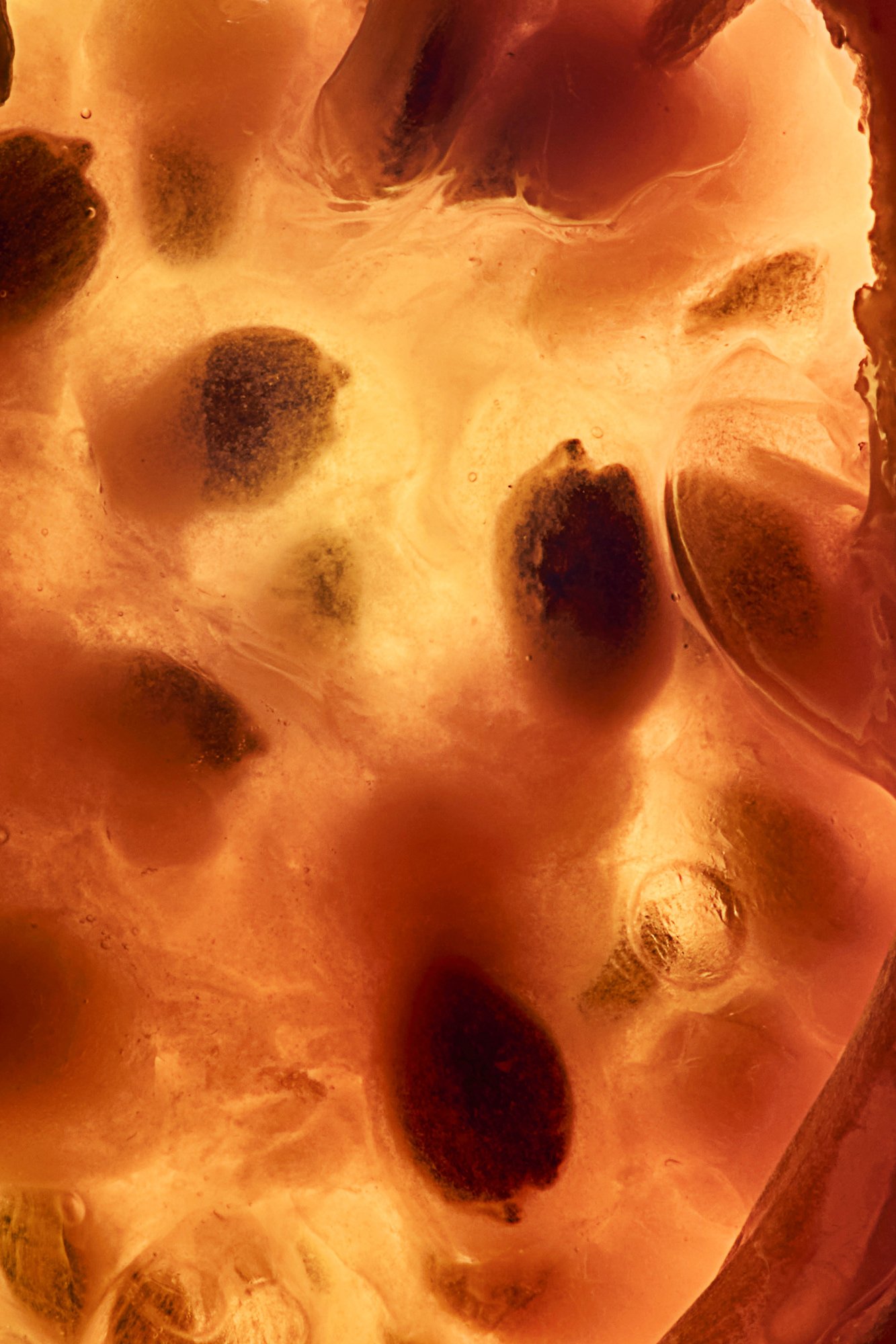 A pomegranate split to show its seeds, Inside Out by Hannah Caldwell