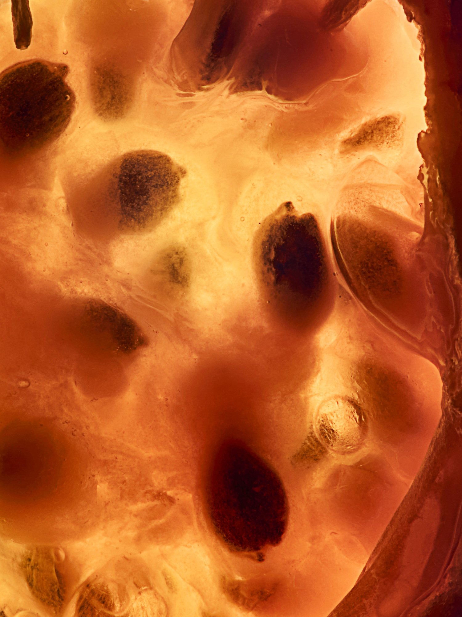 A pomegranate split to show its seeds, Inside Out by Hannah Caldwell