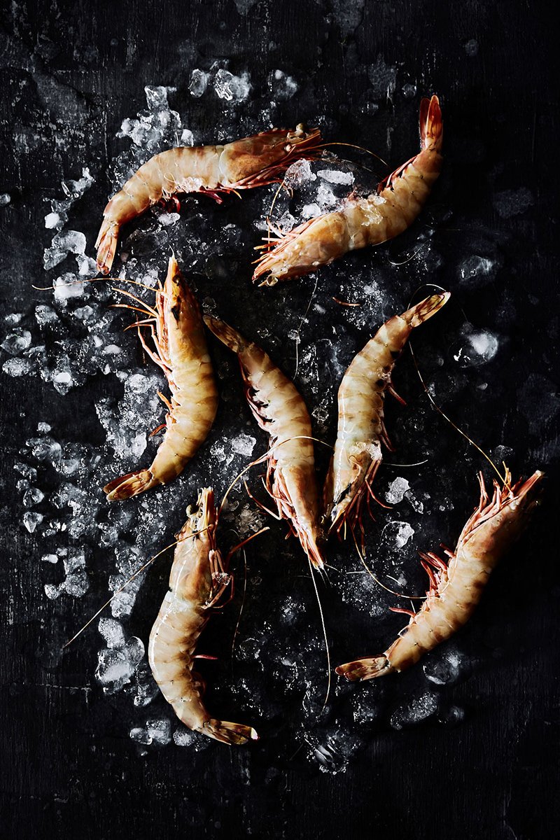 Raw prawns laid over crushed ice, RAW by Hannah Caldwell